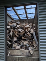 20221220 082444681 woodshed with a bunch of wood