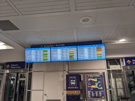 20230121 010814505 yul arrivals board lots of yellow and orange