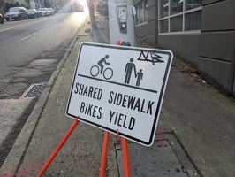 20231213 173422080 shared sidewalk bikes yield