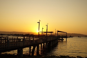 02375 sun behind the pier